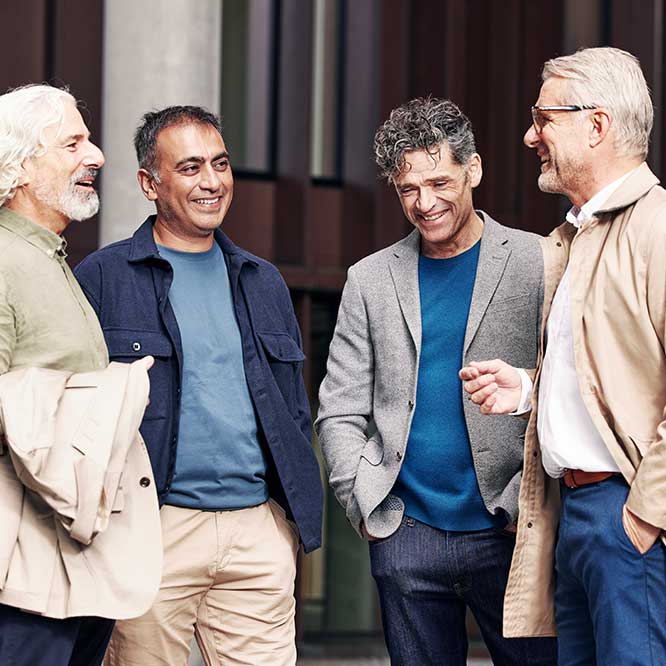 Group of men talking with confidence